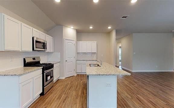 Kitchen, taken while standing in dining area.