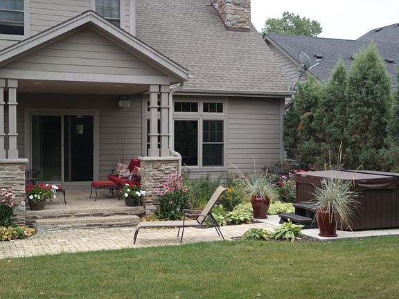 Covered patio and hot tub.
