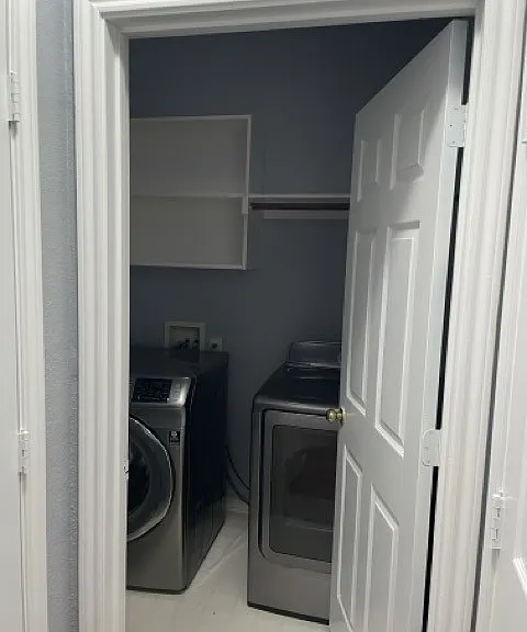 Landry room...off of entry way walk in. Built in shelving. Washer & dryer provided. 

Hallway closet off to the left.