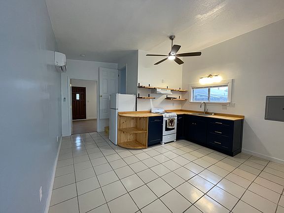 Kitchen & front room view from far corner