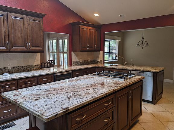 Gourmet kitchen with opening to formal dining room and attached to family room and breakfast nook