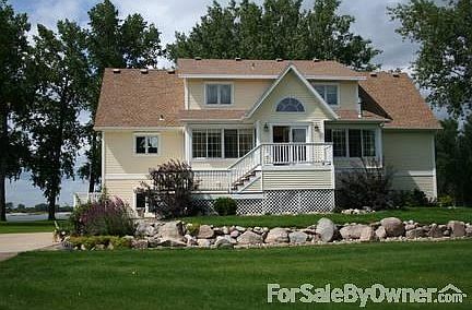 Front of house
						:
						Front entry with large 4 season porch.