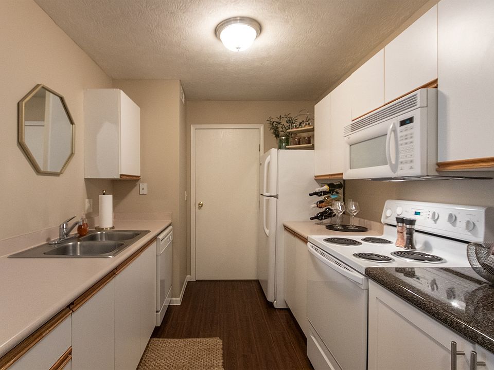 Our model Liberty kitchen features both upgraded cabinetry with dark countertops and classic cabinetry with light countertops.