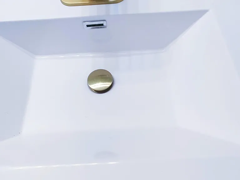 Brand new double sink vanity with gold fixtures and pop up drain