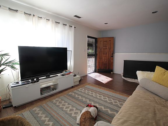 Apartment is unfurnished. Furniture shown for scale only.