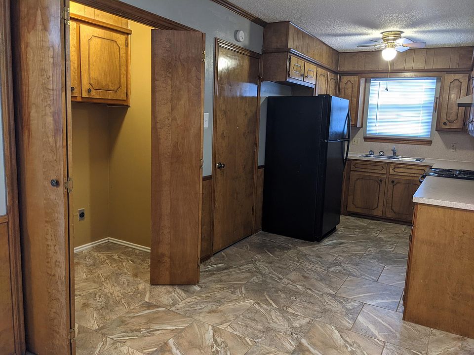 Kitchen and laundry area with hookups.