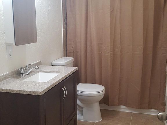 Bathroom with shower curtain in place