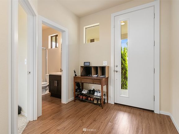  Easy breezy care plank flooring. Perfect spot to leave your shoes and stuff at the door.