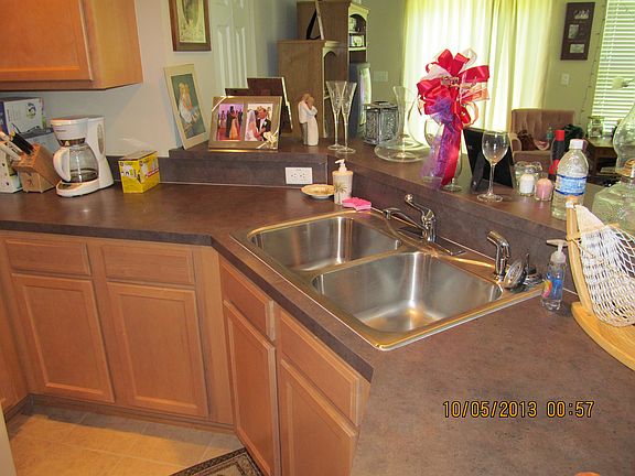 Kitchen has double sink, microwave and dishwasher.