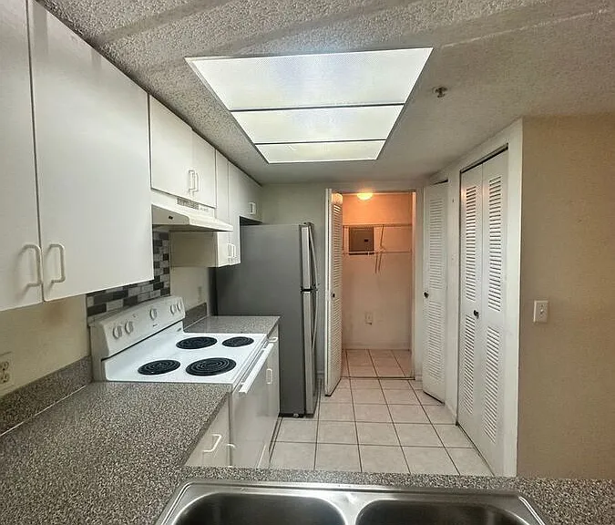 5011 Wiles Rd #3-207 — Photo 3