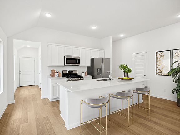Kitchen in the Spruce home plan by Trophy Signature Homes - REPRESENTATIVE PHOTO
