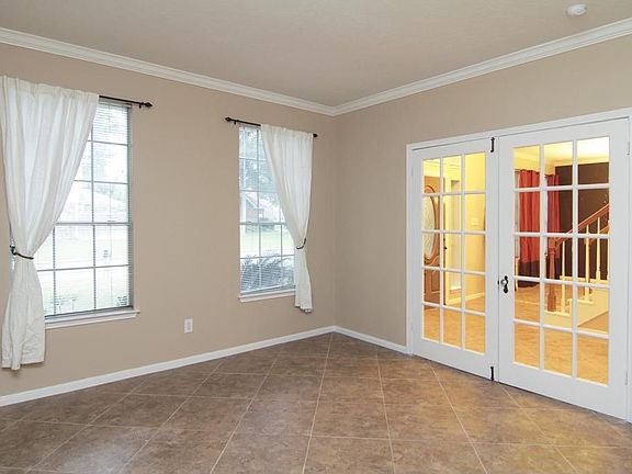 OFFICE -  Just as you walk in to the right is an office with beautiful French doors with sunlight that just beams through the windows!