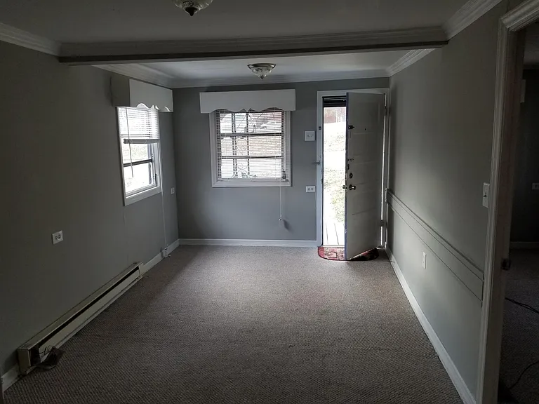View of front room from kitchen area.