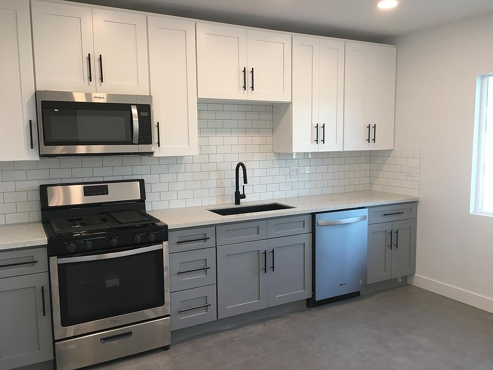 Brand new oven, dishwasher, and sink with garbage disposal.