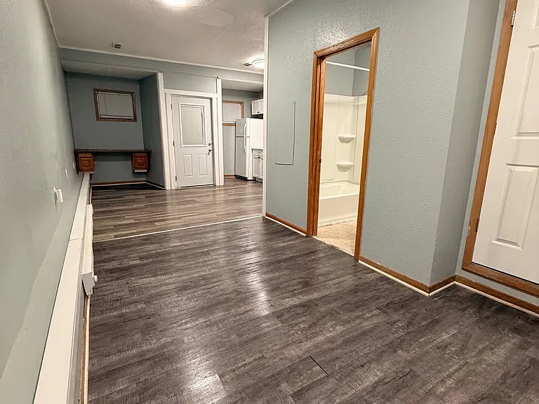 From bedroom door to kitchen and front entry door