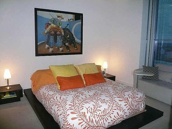 Master Bedroom with Floor to Ceiling Windows and a 50' Plasma TV mounted! Also