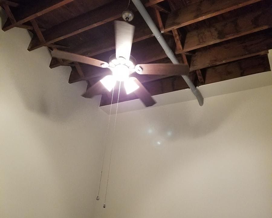 Exposed beams in bedroom