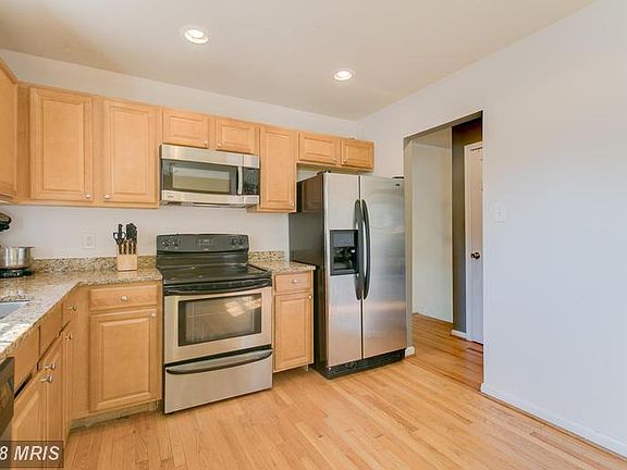 Kitchen with Granite and Stainless Steel Appliance