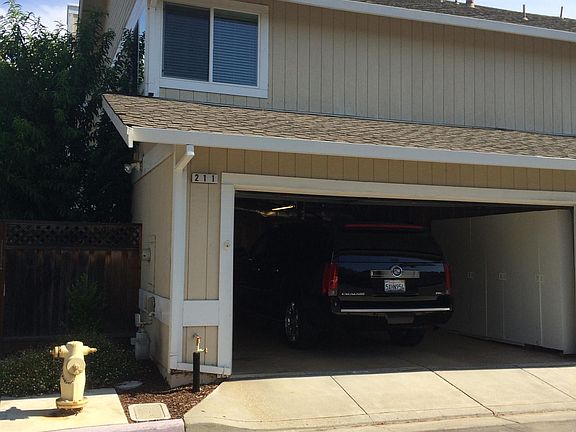 Two car garage w remotes. Plenty of garage storage. End un