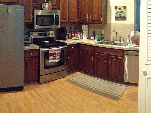 All wood cabinets tiled tops