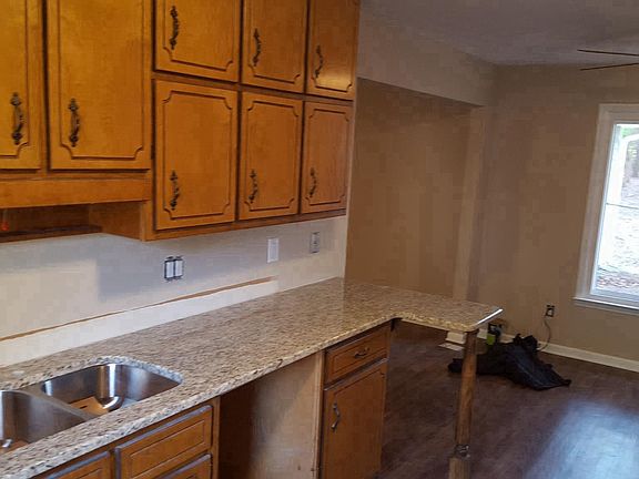 Kitchen with granite counter top, dishwasher (coming)