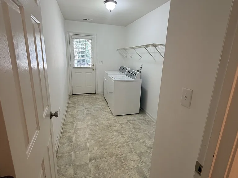 Large Laundry Room-Space for Additional Storage. The vinyl will be replaced by LVP plank flooring shortly