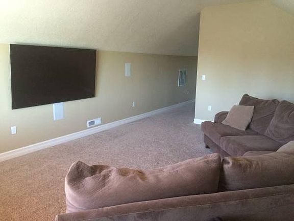 home theater room- can double as second bedroom