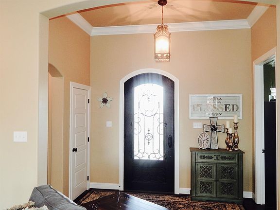 Lovely Entryway With 10 Ft Ceilings And Large Crown Molding.