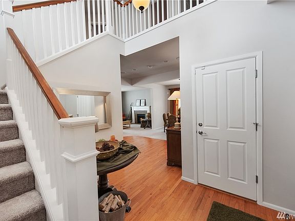 Open foyer entry with hardwood to greet your guests