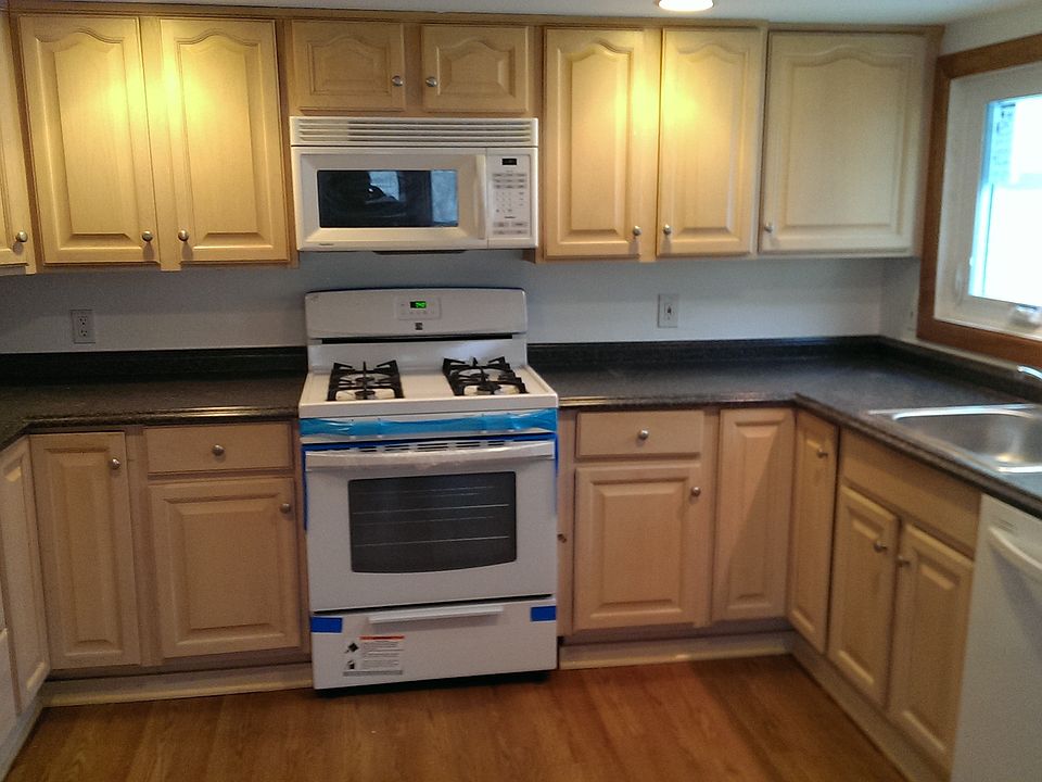 Kitchen with new gas stove, dishwasher, countertops