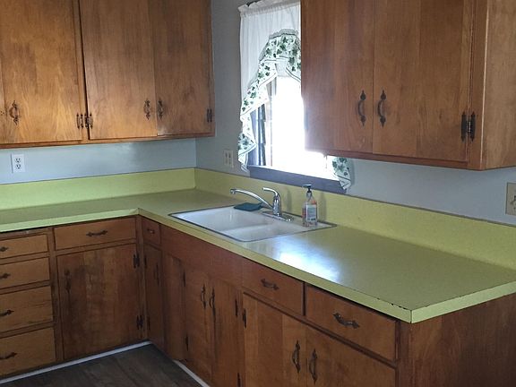 Kitchen sink, counter and cabinets