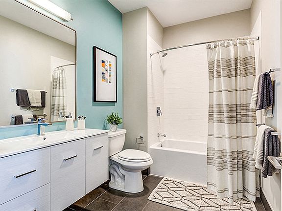 Spa-inspired baths with built-in linen cabinets