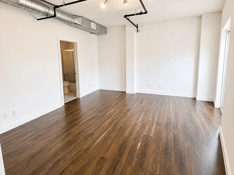 Spacious guest bedroom with en-suite bathroom and large closet.