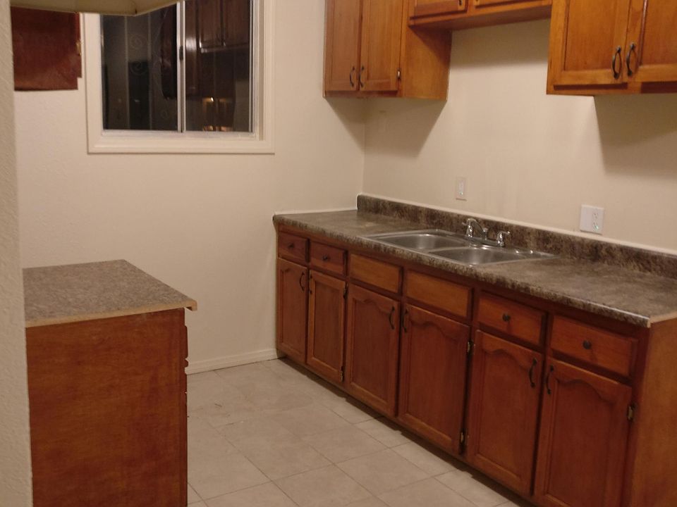 New counter top and newly refinished kitchen cabinets,
