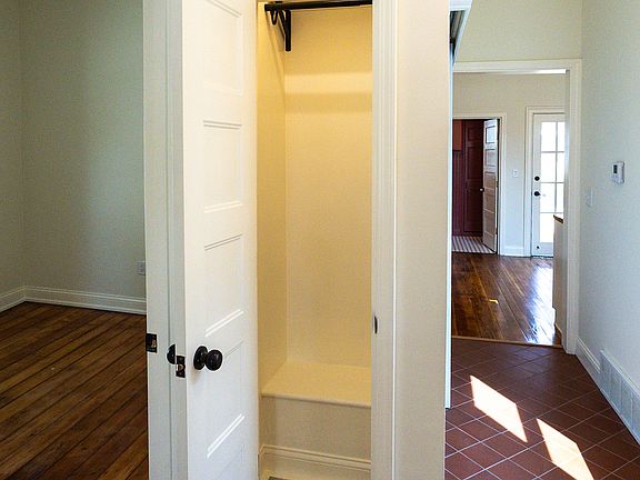 Hallway Coat Closet and Bedroom 1 to the left