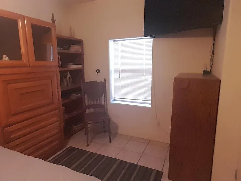 Smart TV, bookcase, dresser.