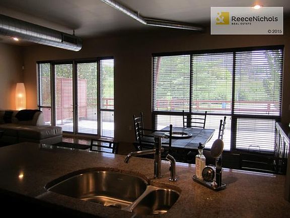 Plantation shutters cover windows overlooking patio, from kitche