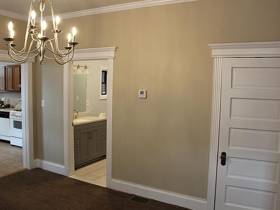 Dining Room looking towards Kitchen, Bathroom, and Walk-In Close (door on right)