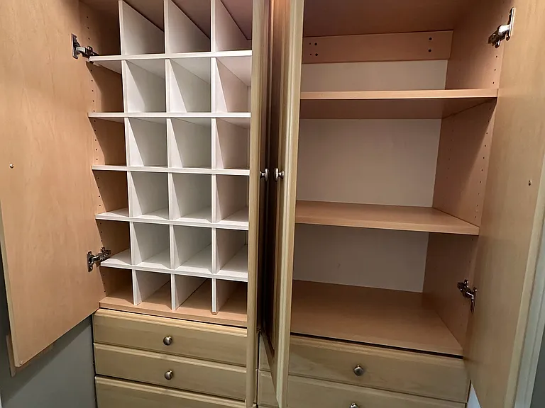 Shoe organizer and extra storage across from walk in closet