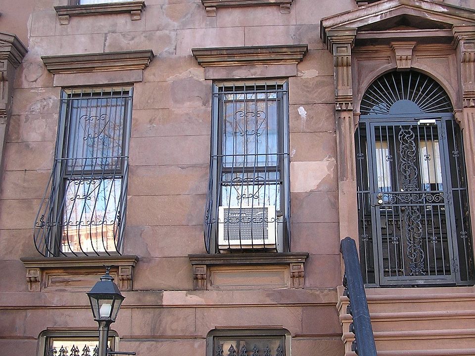 Exposed brick inside with 2 sets of pocket doors and 5 marble fire places