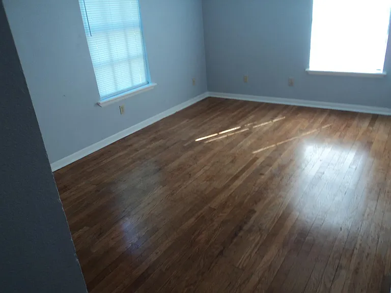 Third bedroom with hardwood floors.