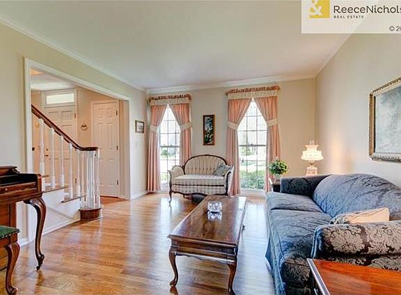 Tall windows and shiny hardwoods highlight this formal LV!