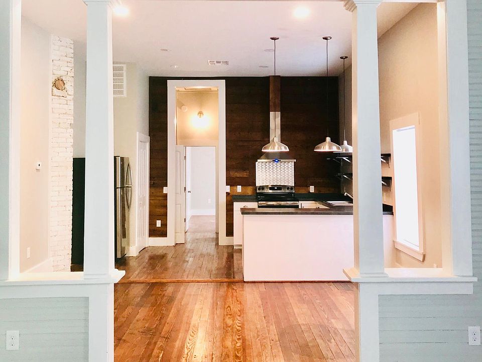 View from living room into dining room area and open kitchen