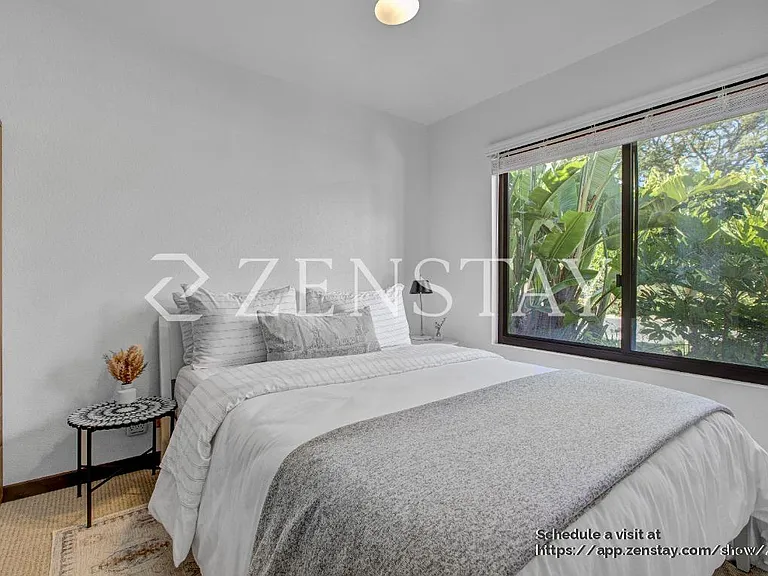 Comfortable bedroom with queen bed and inviting layout