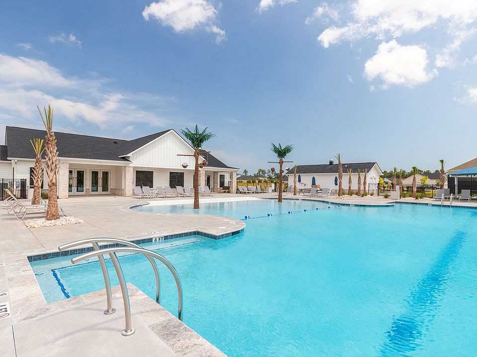 Resort style pool and rear view of Arcadia clubhouse