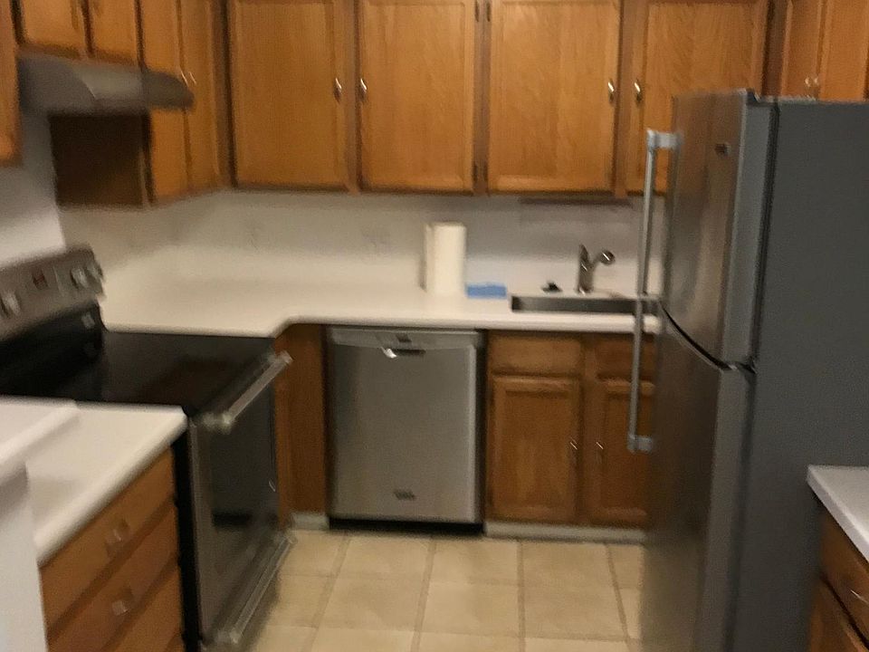 kitchen with stainless steel appliances. ice maker in fridge.