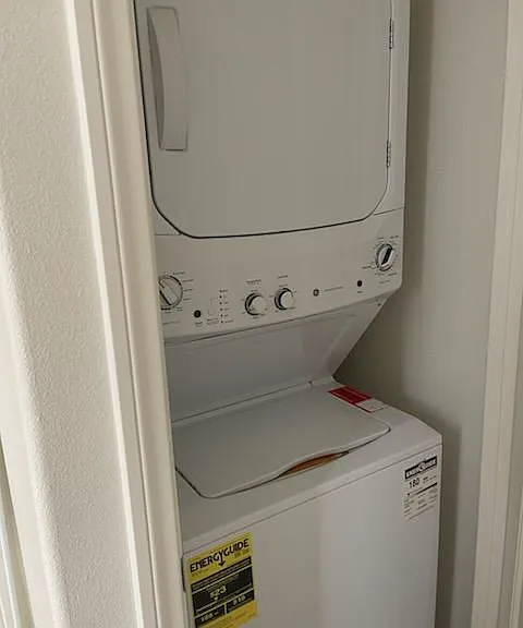 Stackable washer and dryer inside unit. Not shared
