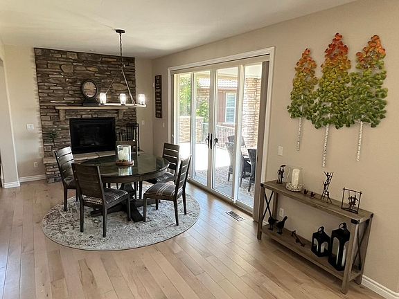 Kitchen dining area with access to large main floor deck and outdoor dining
