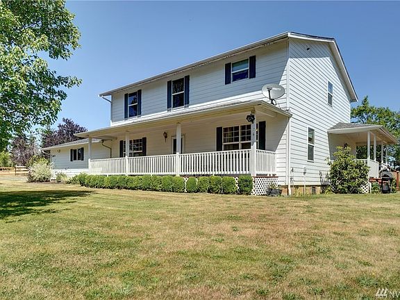 Multiple covered porches overlook this beautiful land. 