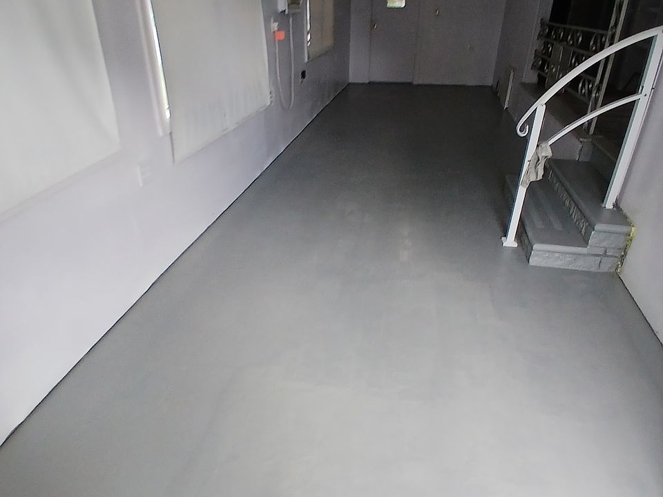 front door view to the back door, on the right side steps is going to the kitchen, bathroom and 2 bedroom.